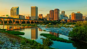 Preview wallpaper river, greens, bridge, buildings, city, sunset