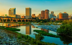 Preview wallpaper river, greens, bridge, buildings, city, sunset