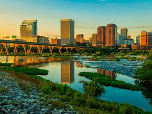 Preview wallpaper river, greens, bridge, buildings, city, sunset