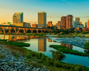 Preview wallpaper river, greens, bridge, buildings, city, sunset