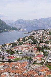 Preview wallpaper river, mountains, buildings, houses, city