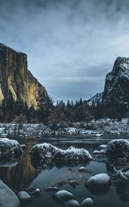 Preview wallpaper river, mountains, stones, shore, trees, cold, snowy