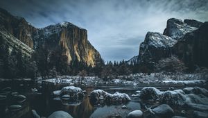 Preview wallpaper river, mountains, stones, shore, trees, cold, snowy