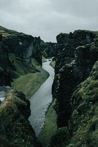 Preview wallpaper river, rocks, cliff, grass, winding