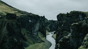 Preview wallpaper river, rocks, cliff, grass, winding