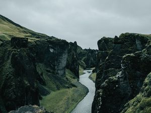 Preview wallpaper river, rocks, cliff, grass, winding