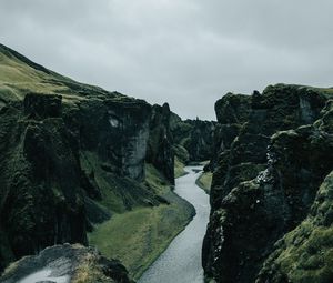 Preview wallpaper river, rocks, cliff, grass, winding