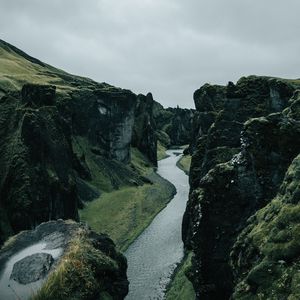 Preview wallpaper river, rocks, cliff, grass, winding