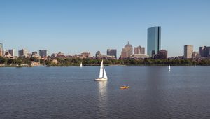 Preview wallpaper river, sail, boat, trees, buildings, city