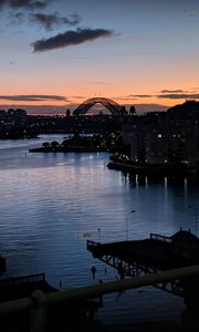 Preview wallpaper river, ship, bridge, city, sunset, dark