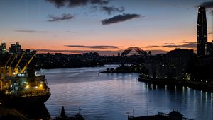 Preview wallpaper river, ship, bridge, city, sunset, dark