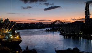 Preview wallpaper river, ship, bridge, city, sunset, dark