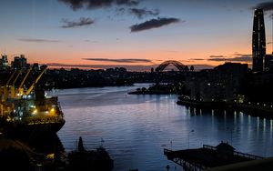 Preview wallpaper river, ship, bridge, city, sunset, dark