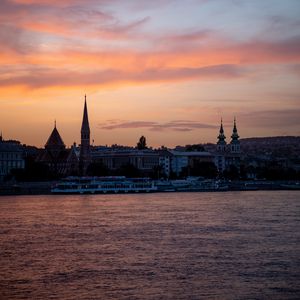 Preview wallpaper river, ship, towers, buildings, twilight, city