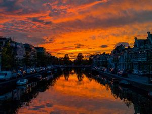 Preview wallpaper river, sunset, canal, city, netherlands