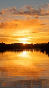 Preview wallpaper river, sunset, trees, silhouettes, clouds