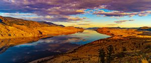 Preview wallpaper river, water, hills, relief, sunset, nature, landscape