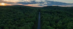 Preview wallpaper road, aerial view, forest, horizon, sunset