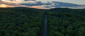 Preview wallpaper road, aerial view, forest, horizon, sunset