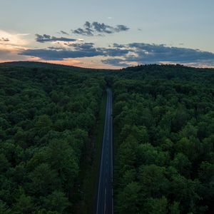 Preview wallpaper road, aerial view, forest, horizon, sunset