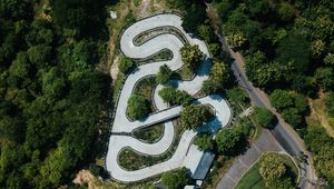 Preview wallpaper road, aerial view, forest, structure