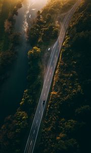Preview wallpaper road, aerial view, river, rays, trees