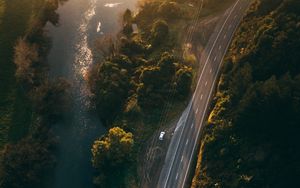 Preview wallpaper road, aerial view, river, rays, trees