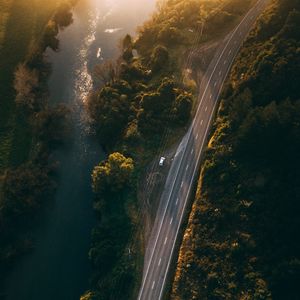 Preview wallpaper road, aerial view, river, rays, trees