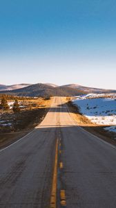 Preview wallpaper road, asphalt, hills, snow, nature