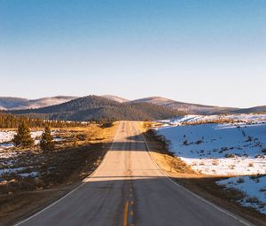 Preview wallpaper road, asphalt, hills, snow, nature