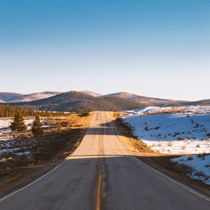 Preview wallpaper road, asphalt, hills, snow, nature