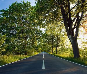 Preview wallpaper road, asphalt, marking, summer, sunlight, trees