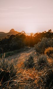 Preview wallpaper road, asphalt, mountains, grass