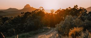 Preview wallpaper road, asphalt, mountains, grass