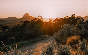 Preview wallpaper road, asphalt, mountains, grass