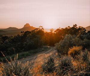 Preview wallpaper road, asphalt, mountains, grass