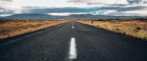 Preview wallpaper road, asphalt, mountains, clouds