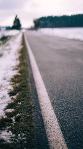 Preview wallpaper road, asphalt, snow, blur