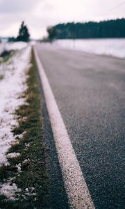 Preview wallpaper road, asphalt, snow, blur