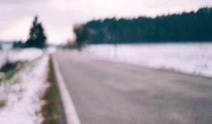 Preview wallpaper road, asphalt, snow, blur