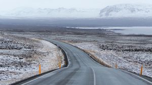 Preview wallpaper road, asphalt, snow, turn, direction, marking
