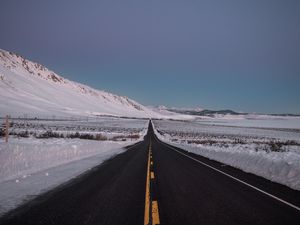 Preview wallpaper road, asphalt, snow, winter, horizon, direction