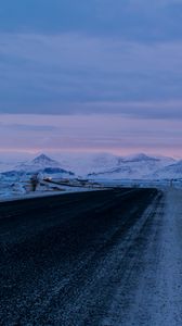 Preview wallpaper road, asphalt, snow, mountains, dusk