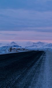 Preview wallpaper road, asphalt, snow, mountains, dusk