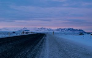 Preview wallpaper road, asphalt, snow, mountains, dusk