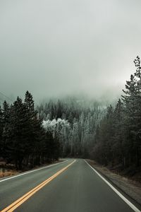 Preview wallpaper road, asphalt, turn, forest, trees, snow, winter