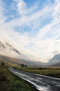 Preview wallpaper road, asphalt, wet, mountains, haze, sky, clouds, way, uncertainty, valley