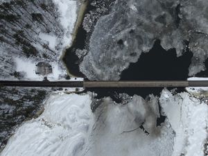 Preview wallpaper road, bridge, river, ice, snow, winter, aerial view