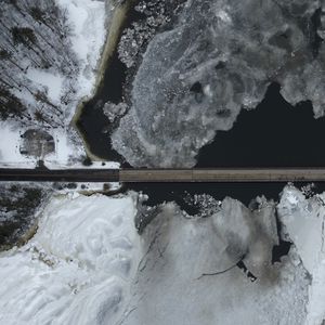 Preview wallpaper road, bridge, river, ice, snow, winter, aerial view