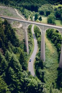 Preview wallpaper road, bridge, trees, forest, car